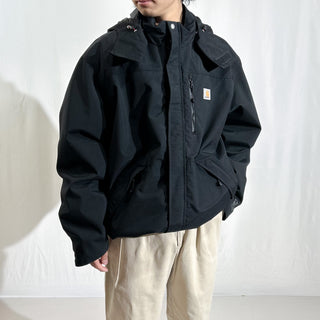 Carhartt "Storm Defender" ブラック 裏メッシュ ドローコード フーデッド ナイロン シェル ジャケット